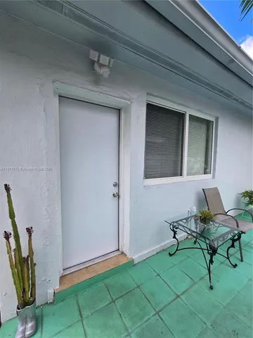 a view of a livingroom with furniture and a gate