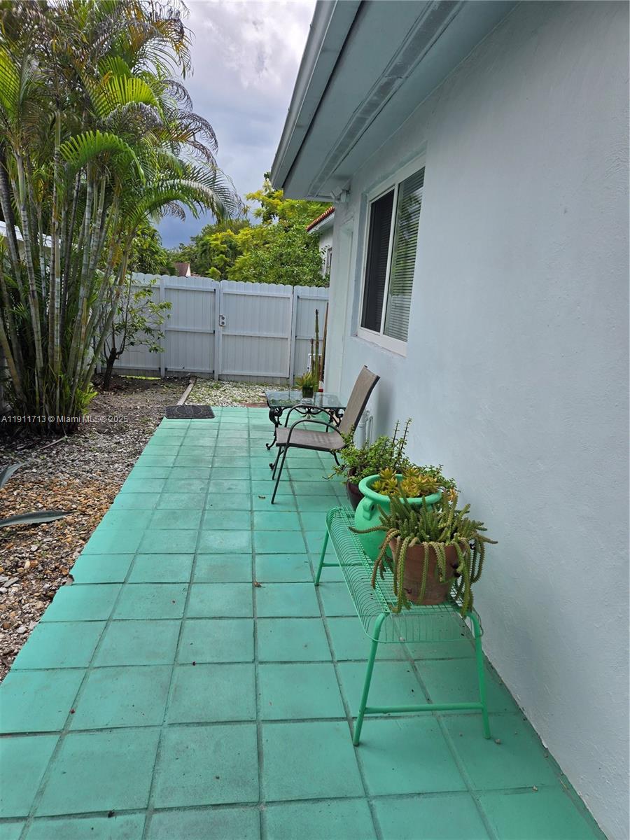 445 Northwest 125th Street, Unit 2 North Miami, FL 33168 - Photo 2 of 10 a view of backyard with seating space
