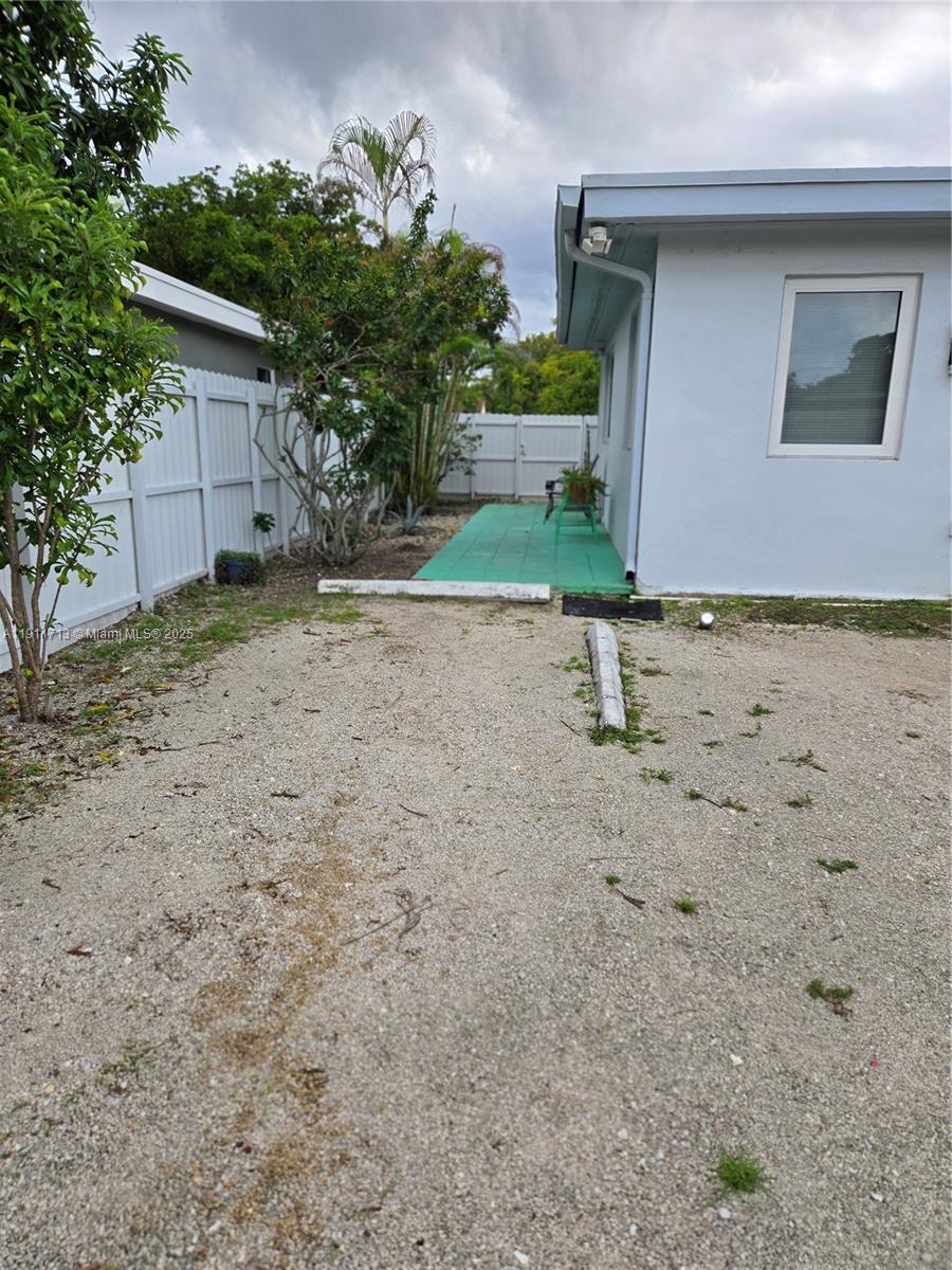 445 Northwest 125th Street, Unit 2 North Miami, FL 33168 - Photo 3 of 10 a backyard of a house with lots of green space