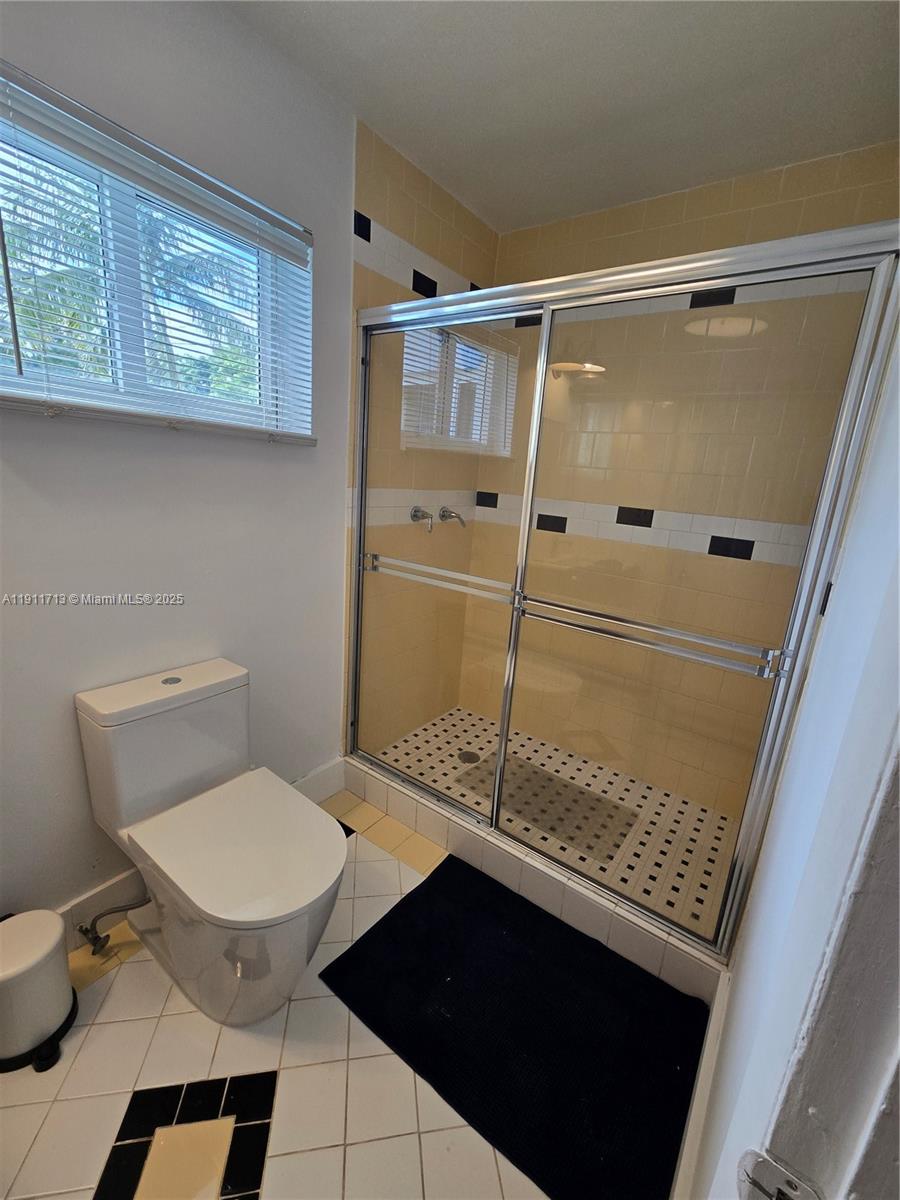 445 Northwest 125th Street, Unit 2 North Miami, FL 33168 - Photo 10 of 10 a bathroom with a sink a toilet and shower