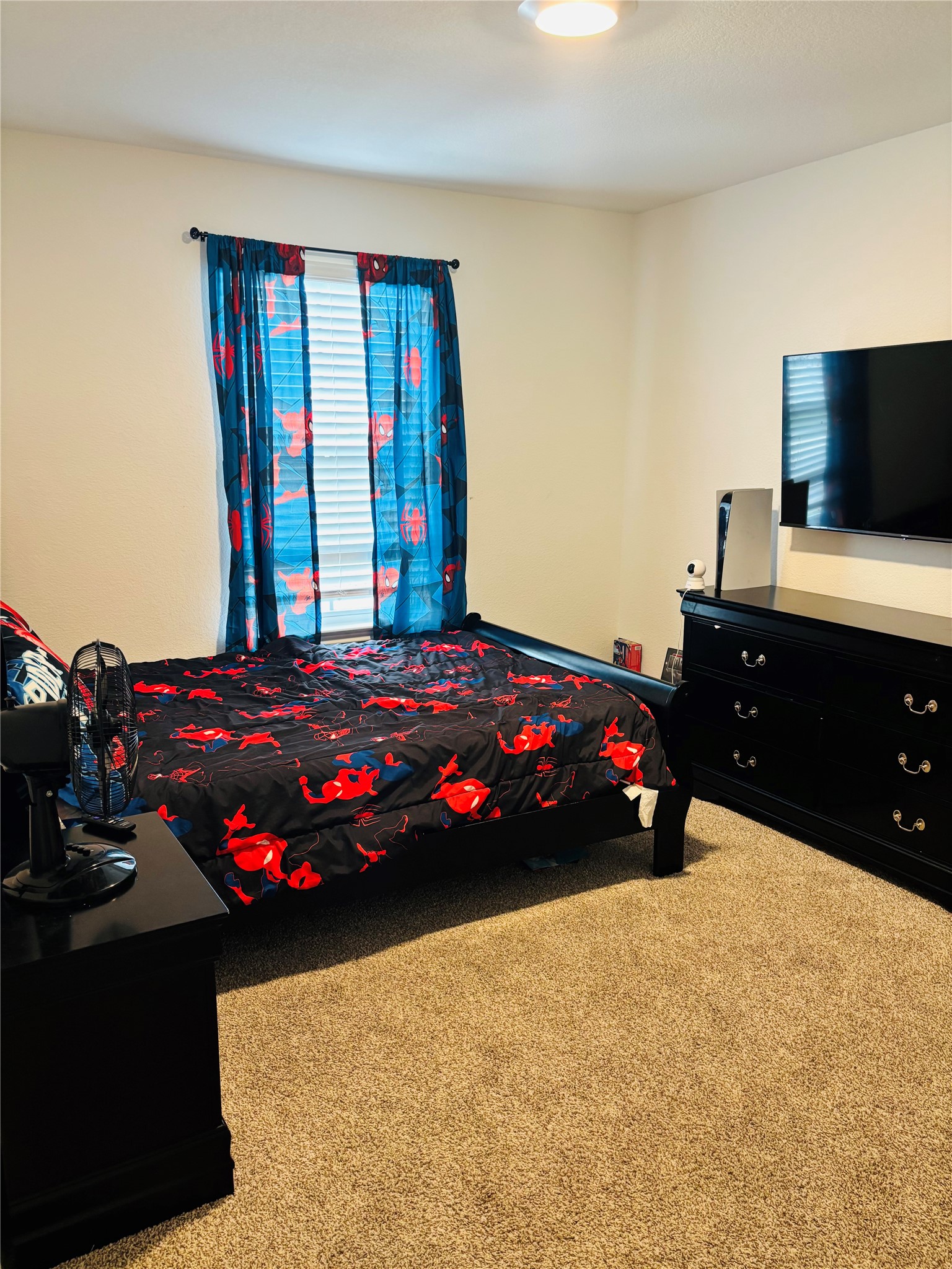 14817 Perlino Way, Unit A Manor, TX 78653 - Photo 11 of 40 a bedroom with a bed and dresser