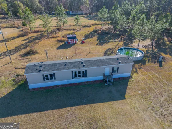 a view of a backyard with a yard