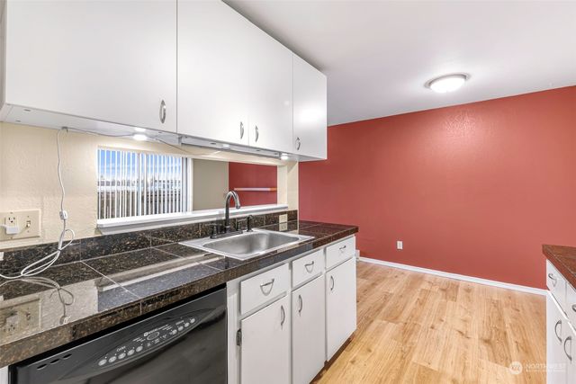 a kitchen with a sink and a stove