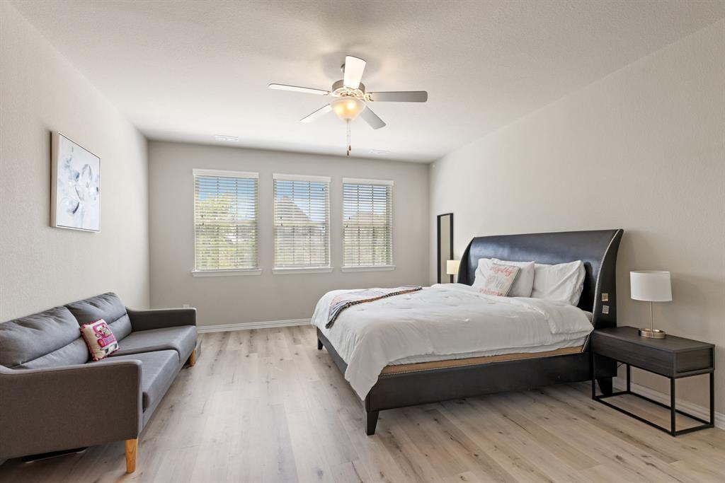 620 Ansley Way Allen, TX 75013 - Photo 18 of 31 a bedroom with a bed and a couch