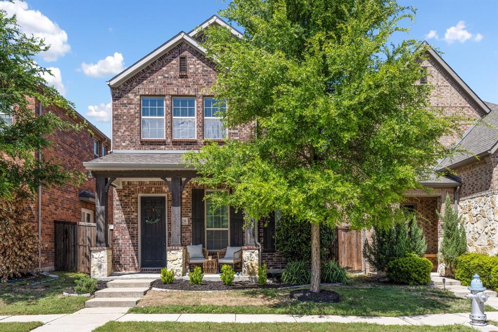 620 Ansley Way Allen, TX 75013 - Photo 2 of 31 a front view of a house with garden