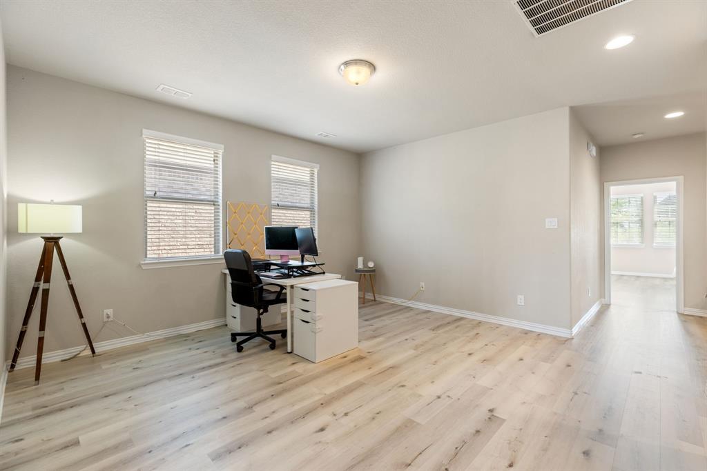 620 Ansley Way Allen, TX 75013 - Photo 24 of 31 a workspace with furniture and a wooden floor