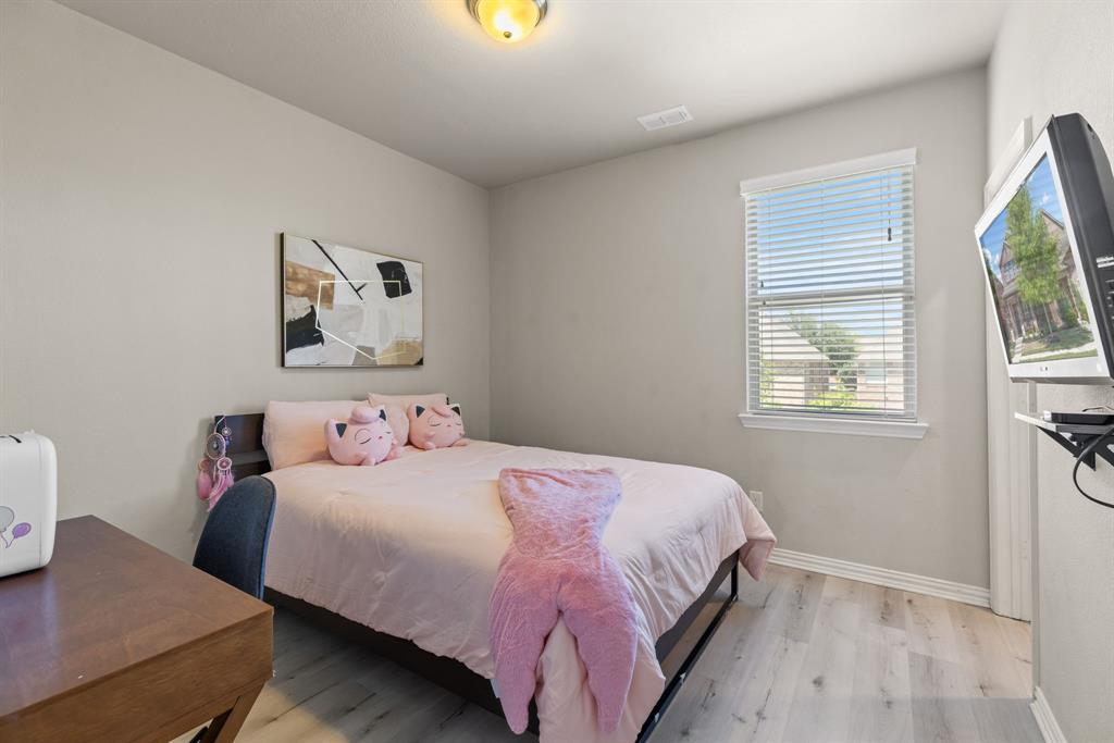 620 Ansley Way Allen, TX 75013 - Photo 26 of 31 a bedroom with bed and a window