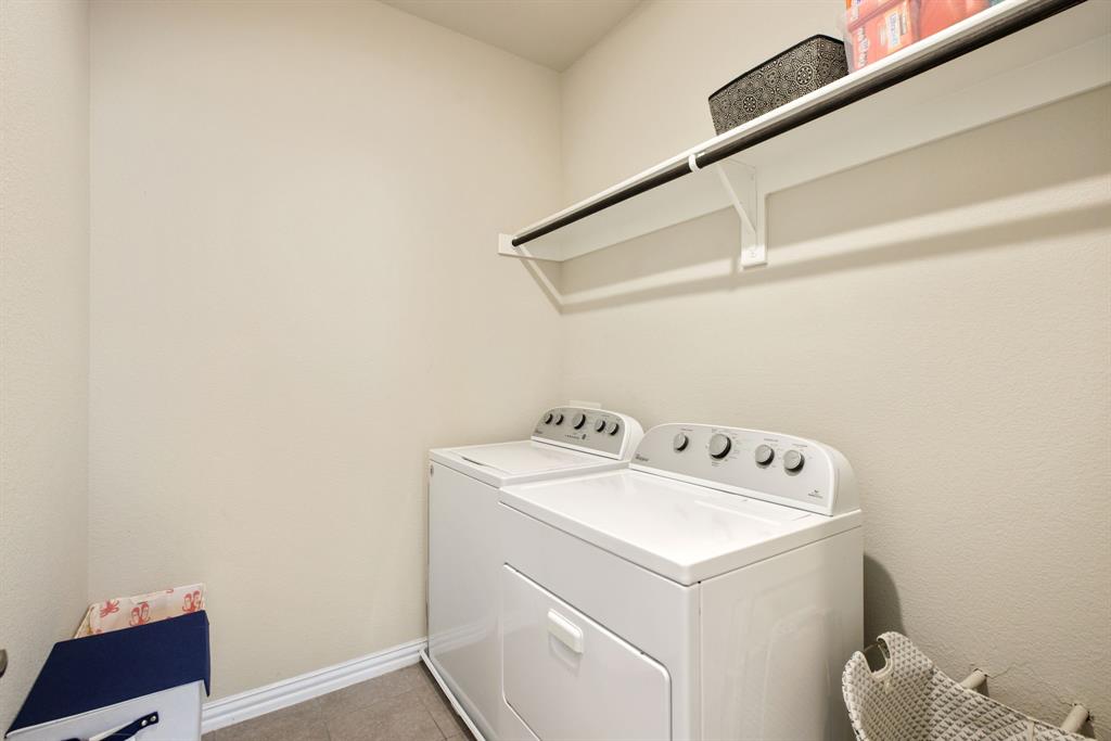 620 Ansley Way Allen, TX 75013 - Photo 28 of 31 a utility room with dryer and washer