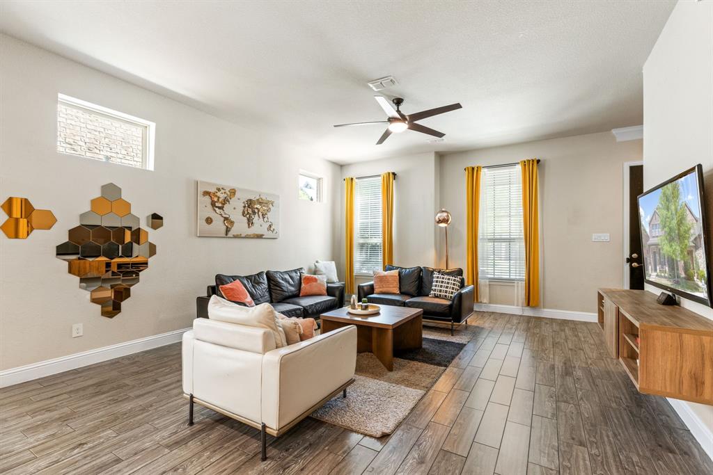 620 Ansley Way Allen, TX 75013 - Photo 6 of 31 a living room with furniture and a flat screen tv