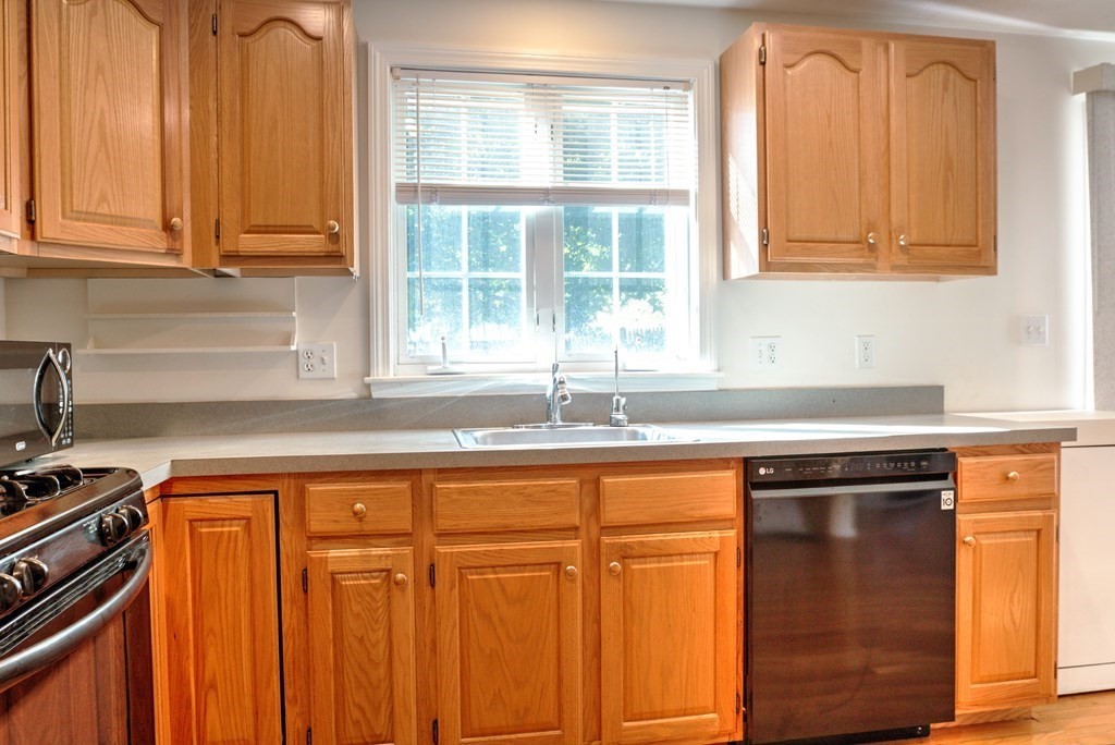 1278 Trapelo Road Waltham, MA 02451 - Photo 8 of 42 a kitchen with stainless steel appliances granite countertop a sink and a cabinets