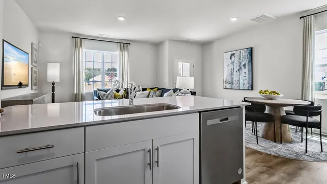 a kitchen with a sink cabinets and window