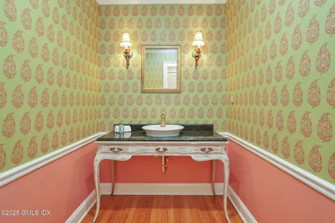 a view of a bathroom with a sink and a mirror