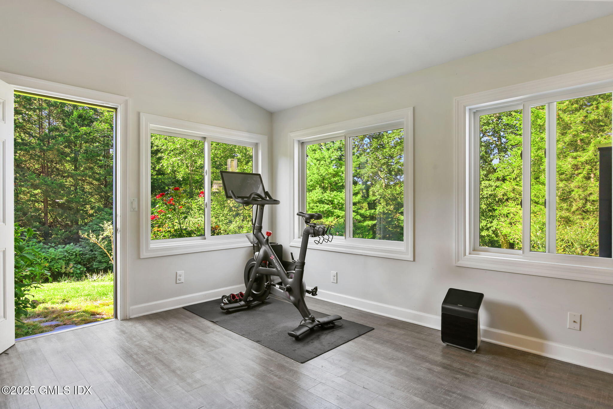 7 Pleasant View Place Old Greenwich, CT 06870 - Photo 12 of 22 a view of a room with gym equipment and a floor to ceiling window