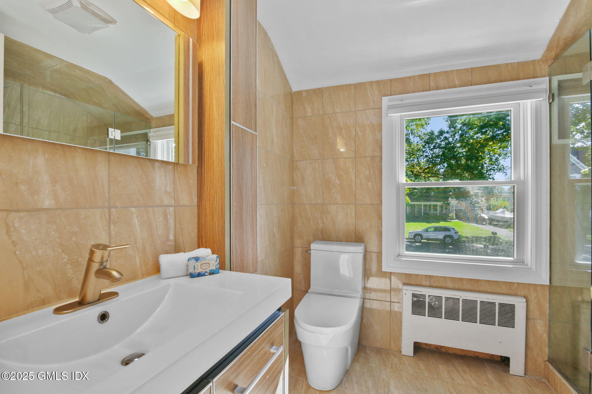 7 Pleasant View Place Old Greenwich, CT 06870 - Photo 15 of 22 a bathroom with a sink a toilet and tub