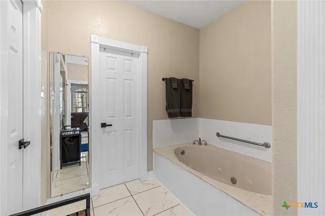 a kitchen with stainless steel appliances granite countertop a refrigerator stove top oven a sink and dishwasher