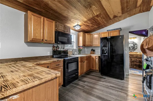 a view of a swimming pool with an outdoor space and seating area