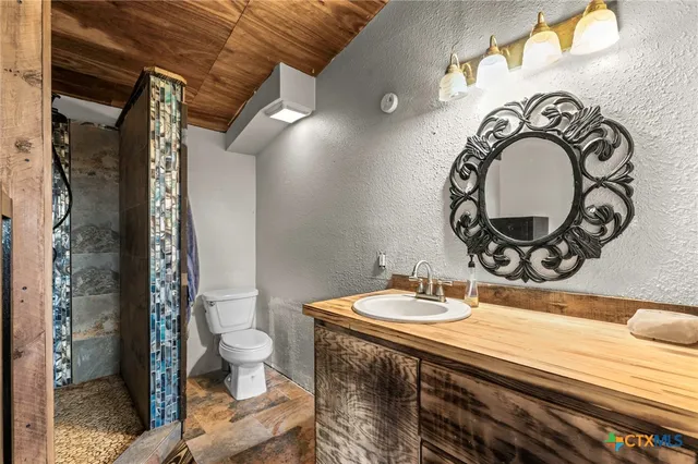 a view of a room with wooden walls