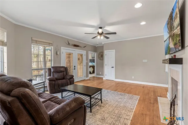 a living room with furniture and a fireplace