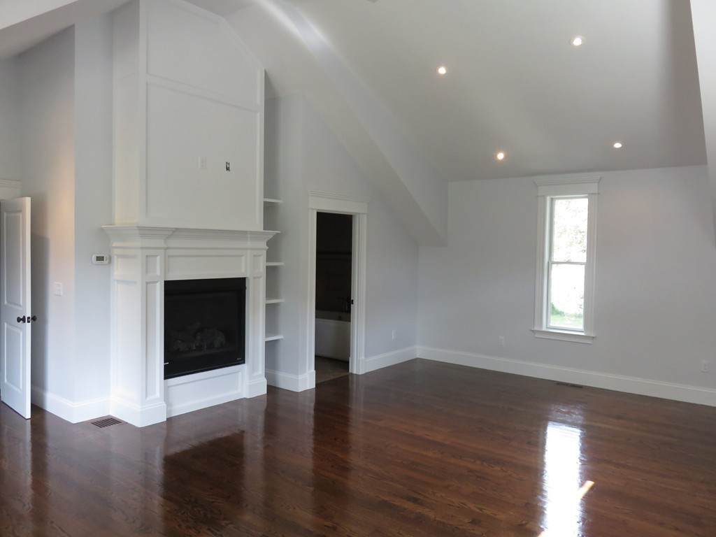 12 Maple Street Newton, MA 02466 - Photo 12 of 28 a view of a livingroom with wooden floor and a fireplace