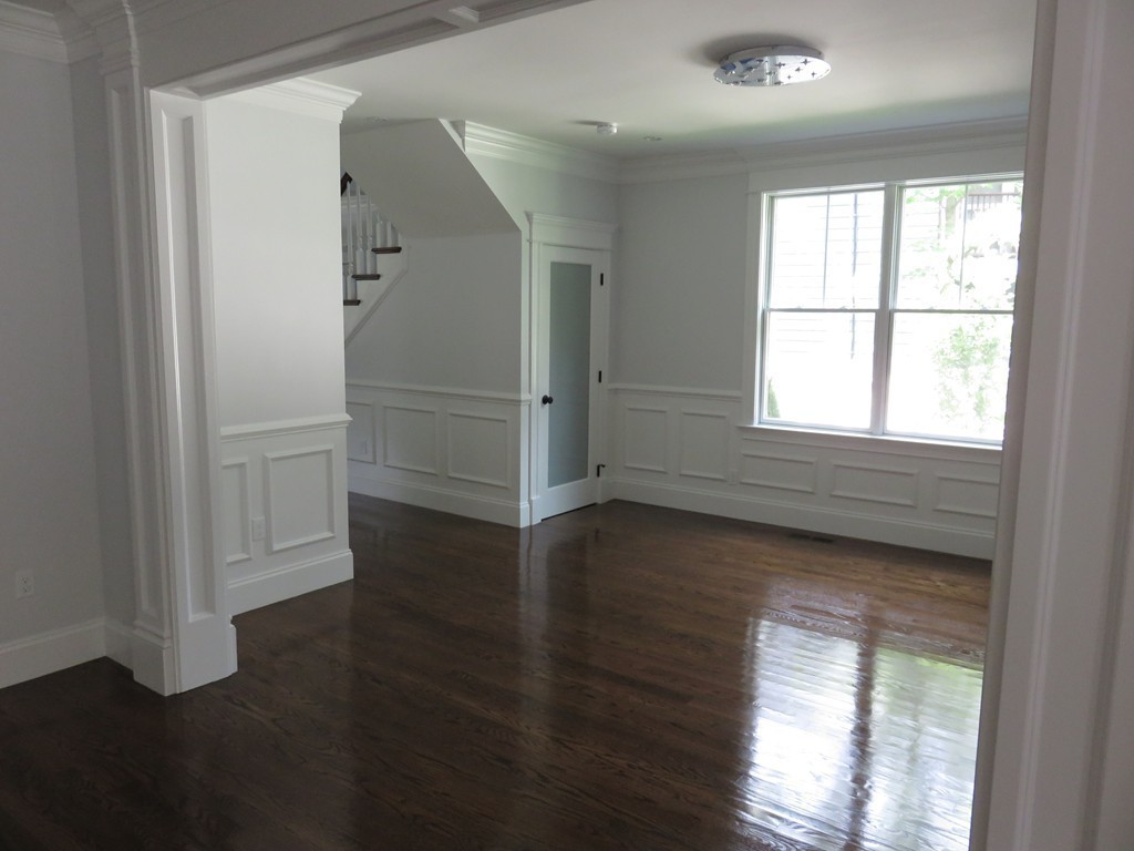 12 Maple Street Newton, MA 02466 - Photo 15 of 28 an empty room with wooden floor and windows
