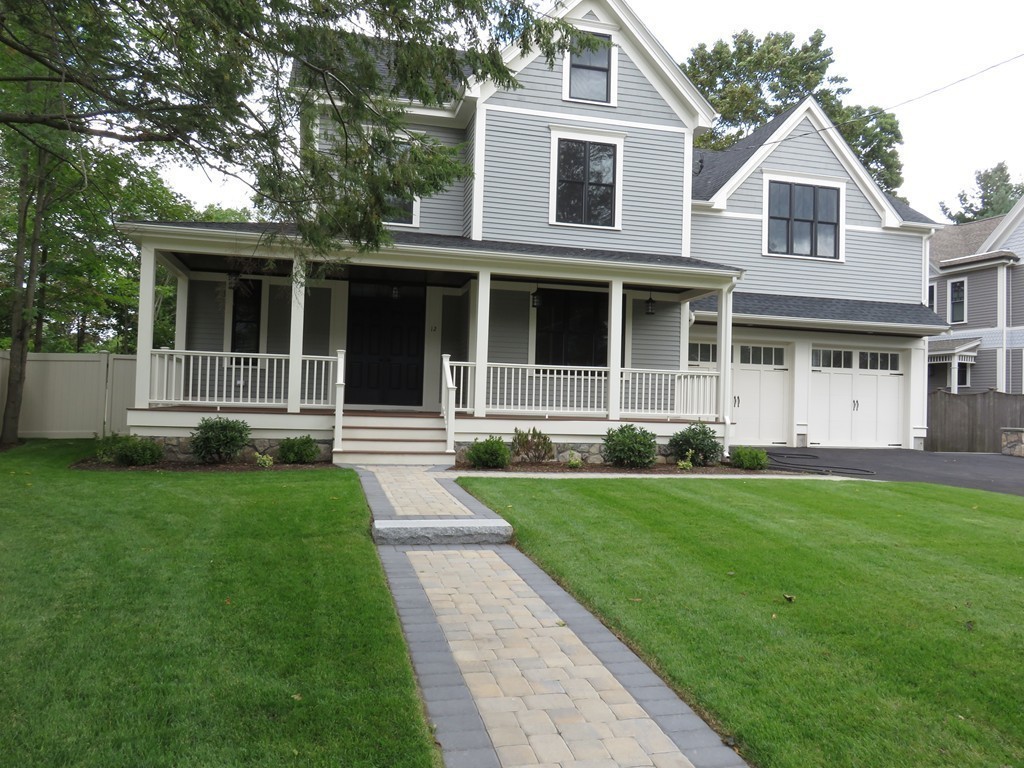 12 Maple Street Newton, MA 02466 - Photo 2 of 28 a front view of a house with a yard