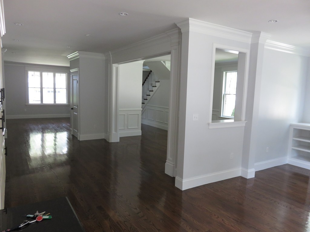 12 Maple Street Newton, MA 02466 - Photo 21 of 28 an empty room with wooden floor and windows
