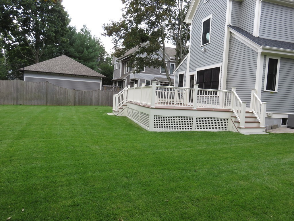 12 Maple Street Newton, MA 02466 - Photo 27 of 28 a view of house with backyard and a garden
