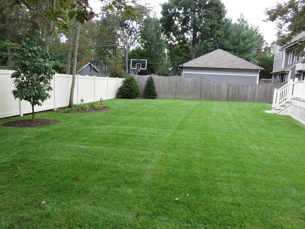 12 Maple Street Newton, MA 02466 - Photo 28 of 28 a front view of a house with garden