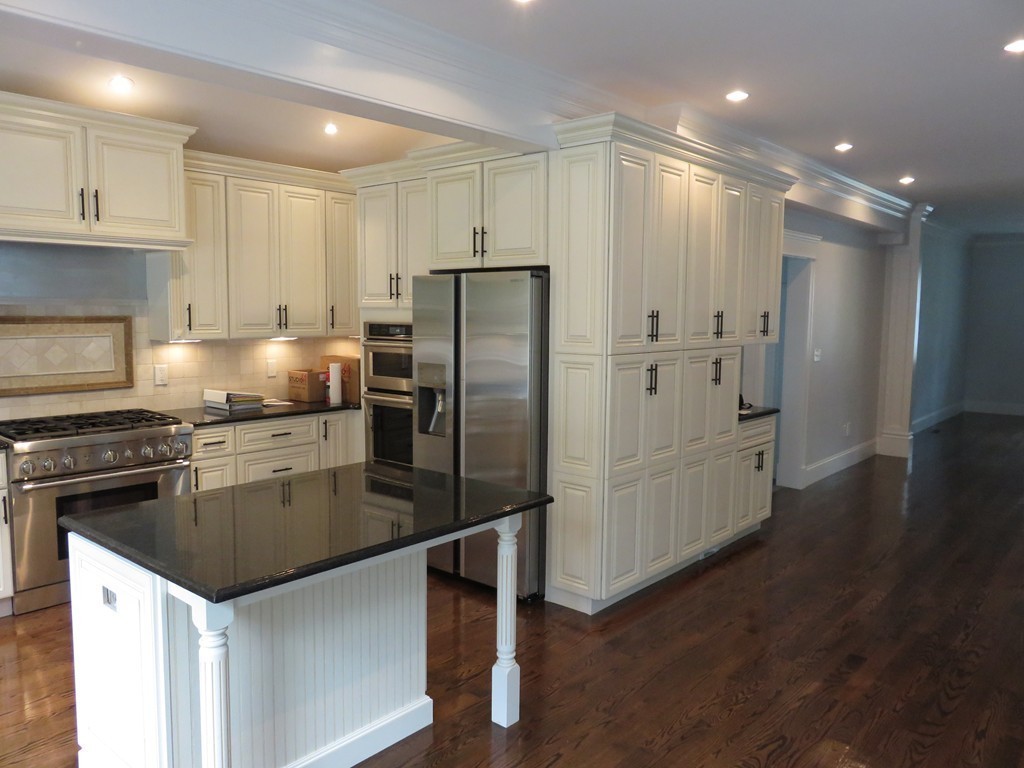 12 Maple Street Newton, MA 02466 - Photo 5 of 28 a kitchen with a refrigerator sink and cabinets