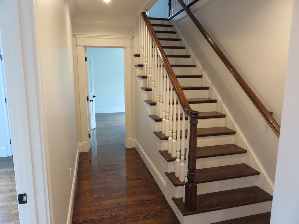 12 Maple Street Newton, MA 02466 - Photo 10 of 28 a view of entryway and hall with wooden floor