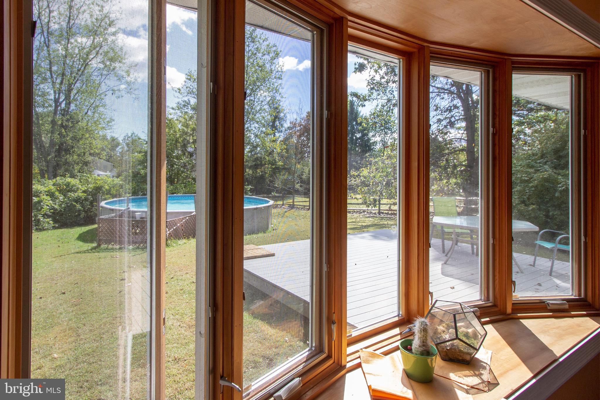 162 Klingerman Road Telford, PA 18969 - Photo 8 of 27 Living Room to Composite Deck and Pool
