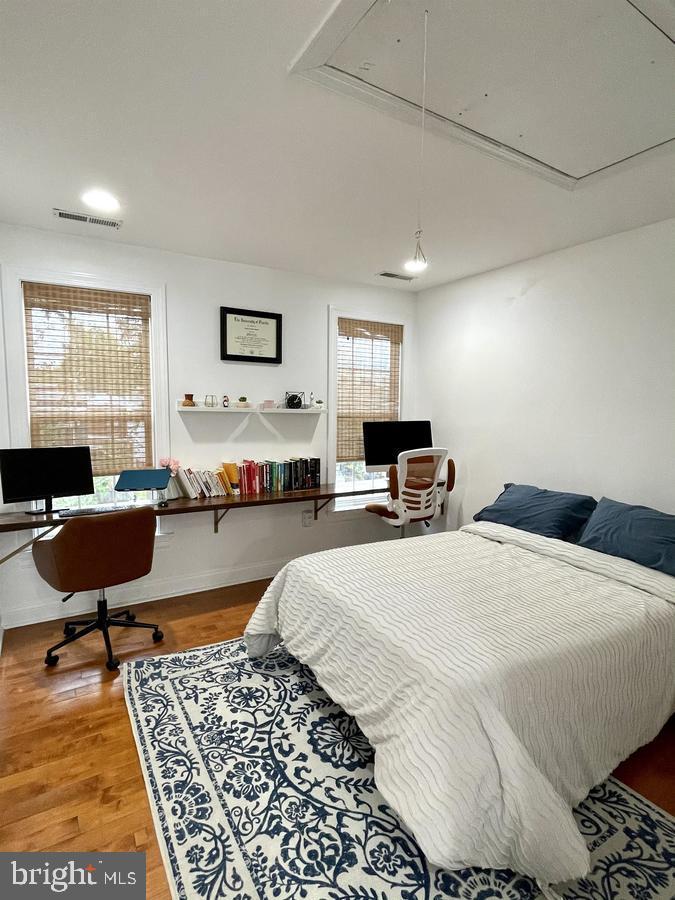 1656 Kramer Street Northeast Washington, DC 20002 - Photo 14 of 29 a bed room with a bed and a chair