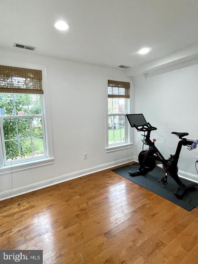 1656 Kramer Street Northeast Washington, DC 20002 - Photo 19 of 29 a view of room with wooden floor and gym equipment