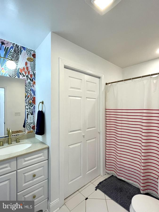 1656 Kramer Street Northeast Washington, DC 20002 - Photo 20 of 29 a bathroom with a sink and a mirror