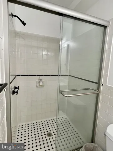 a bathroom with a shower and a toilet