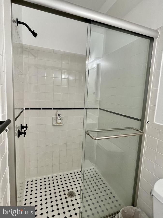1656 Kramer Street Northeast Washington, DC 20002 - Photo 23 of 29 a bathroom with a shower and a toilet