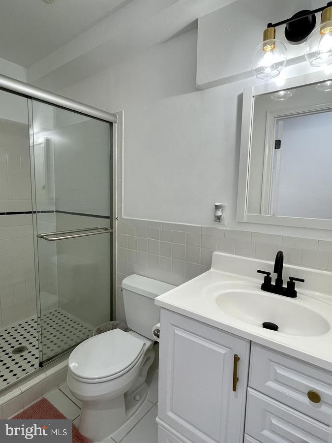 1656 Kramer Street Northeast Washington, DC 20002 - Photo 24 of 29 a bathroom with a sink toilet and shower