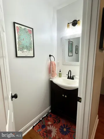 a bathroom with a sink and mirror
