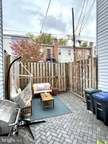a outdoor space with patio couch and chairs