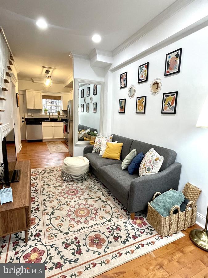 1656 Kramer Street Northeast Washington, DC 20002 - Photo 5 of 29 a living room with furniture and a rug
