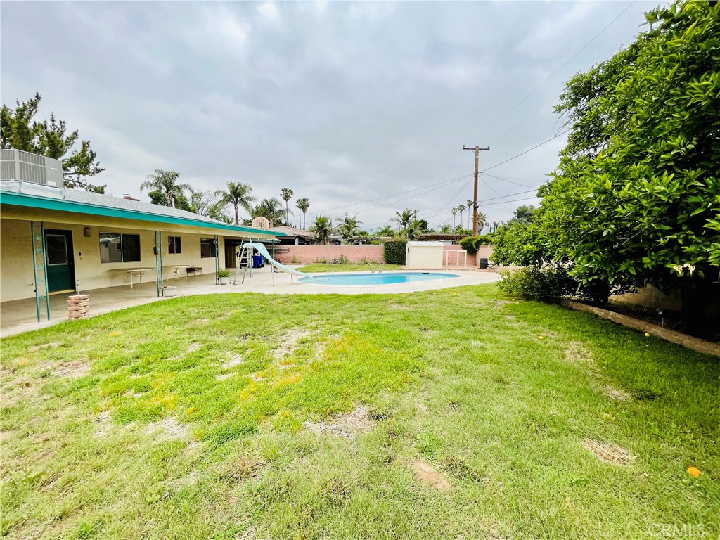 5875 Olive Avenue Rialto, CA 92377 - Photo 50 of 54 a view of swimming pool with lawn chairs and plants