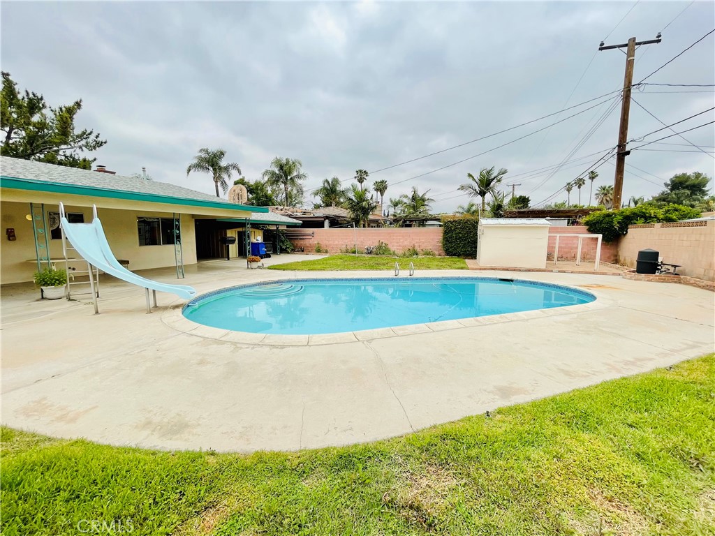 5875 Olive Avenue Rialto, CA 92377 - Photo 51 of 54 a view of a swimming pool with a patio