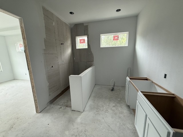 127 Riparian Elms Road Bertram, TX 78605 - Photo 12 of 22 A partially finished kitchen space awaits personalized touches and modern appliances.