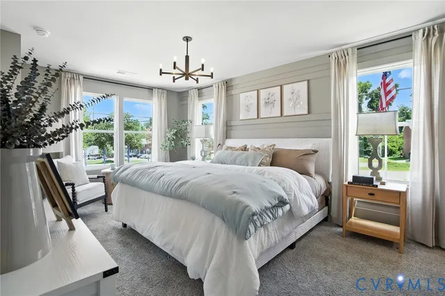 a spacious bedroom with a large bed and a couch