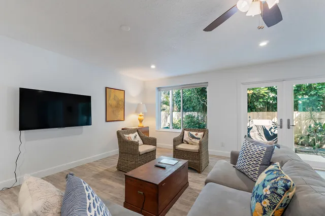 a view of a porch with chairs and backyard