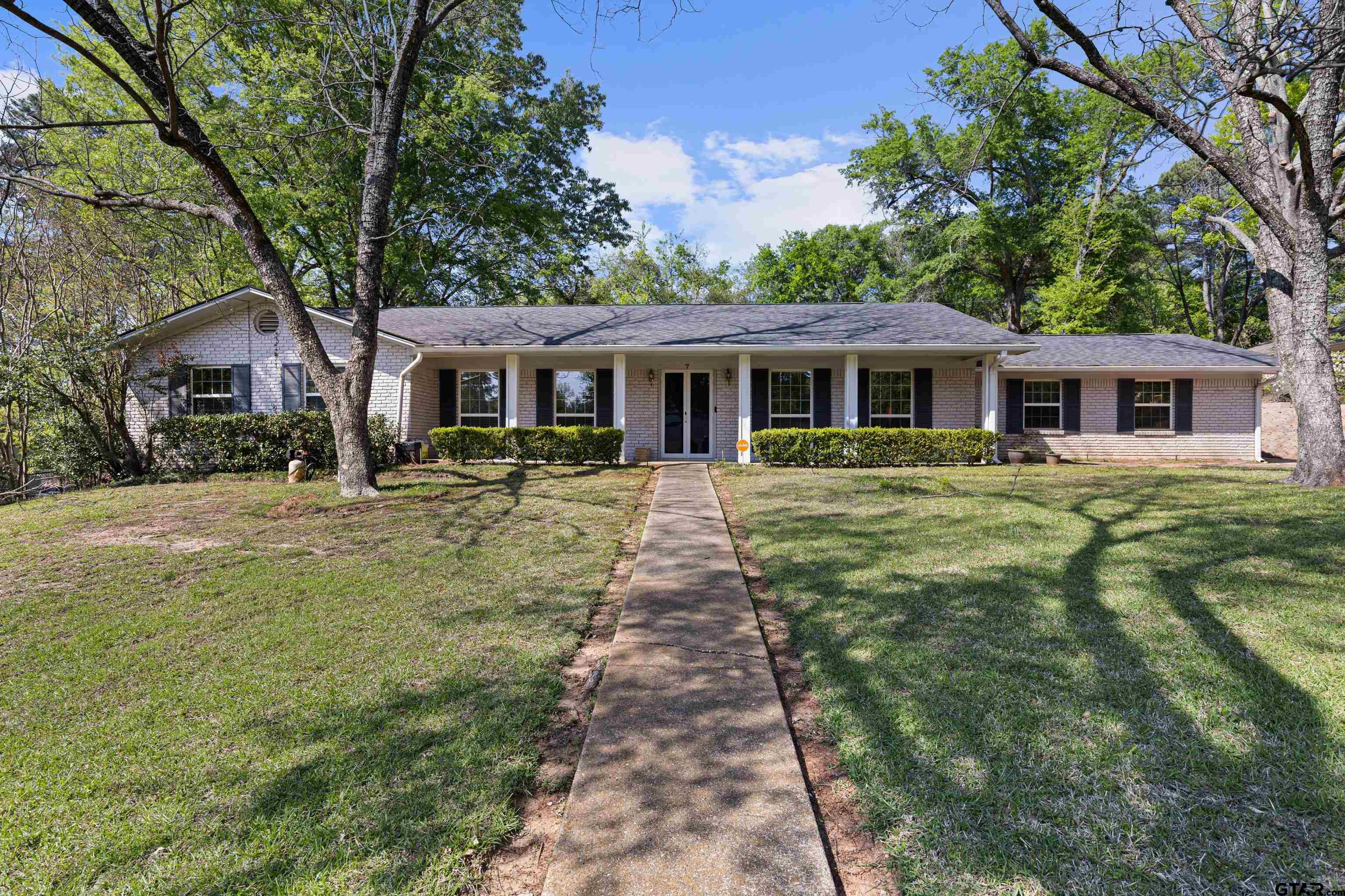 7 Lindsey Lane Longview, TX 75601 - Photo 1 of 36 a front view of house with yard and green space