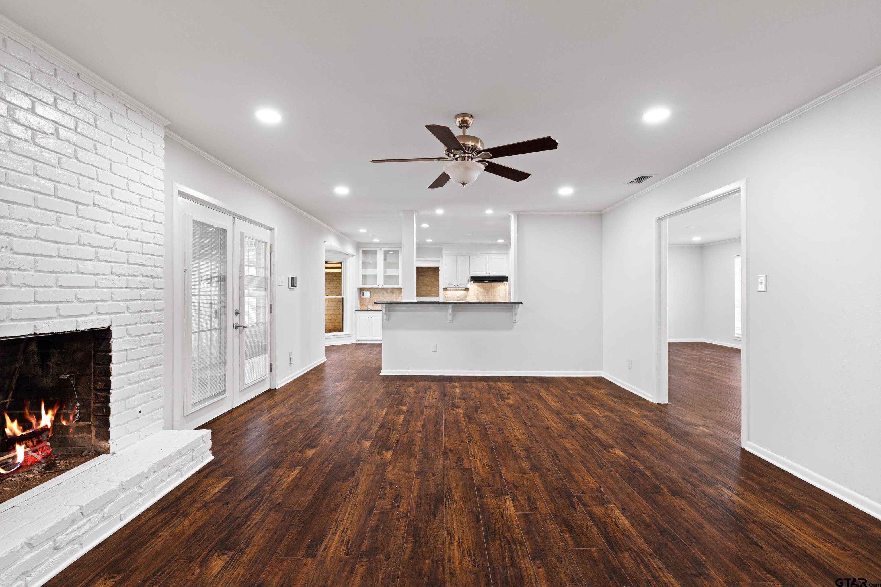 7 Lindsey Lane Longview, TX 75601 - Photo 11 of 36 a view of a kitchen with wooden floor and a kitchen