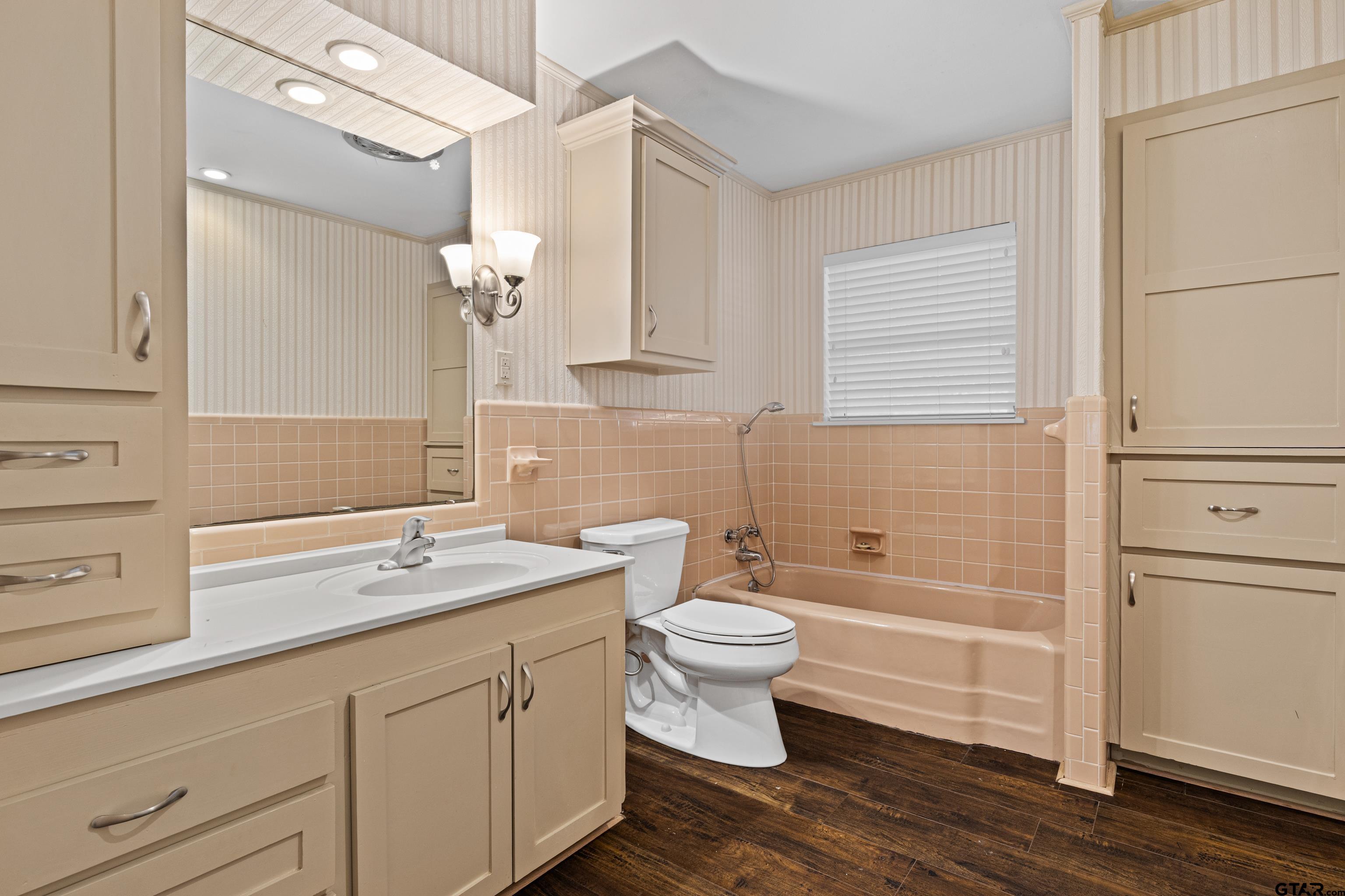 7 Lindsey Lane Longview, TX 75601 - Photo 23 of 36 a bathroom with a sink a toilet and bathtub