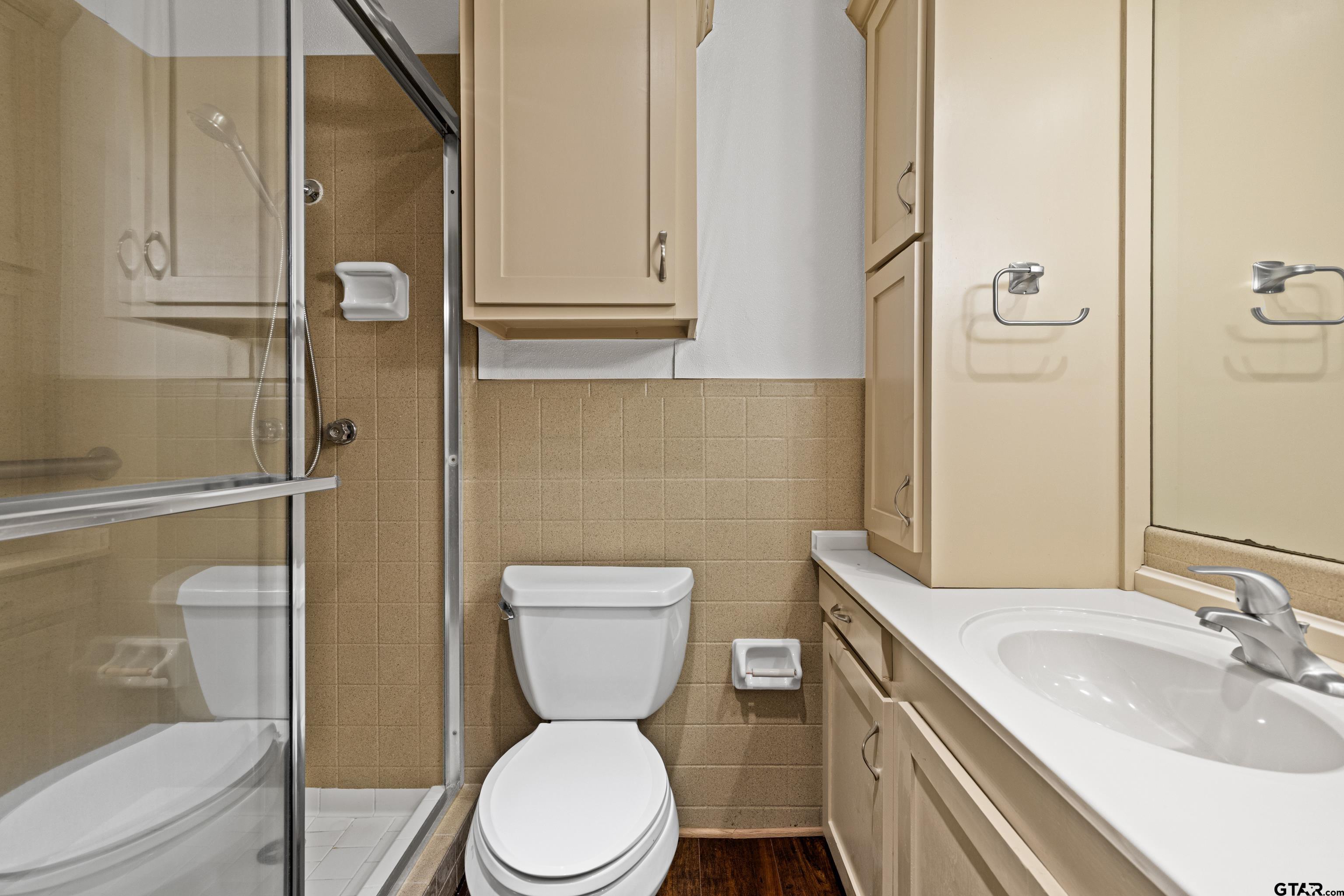 7 Lindsey Lane Longview, TX 75601 - Photo 30 of 36 a bathroom with a toilet a sink and shower