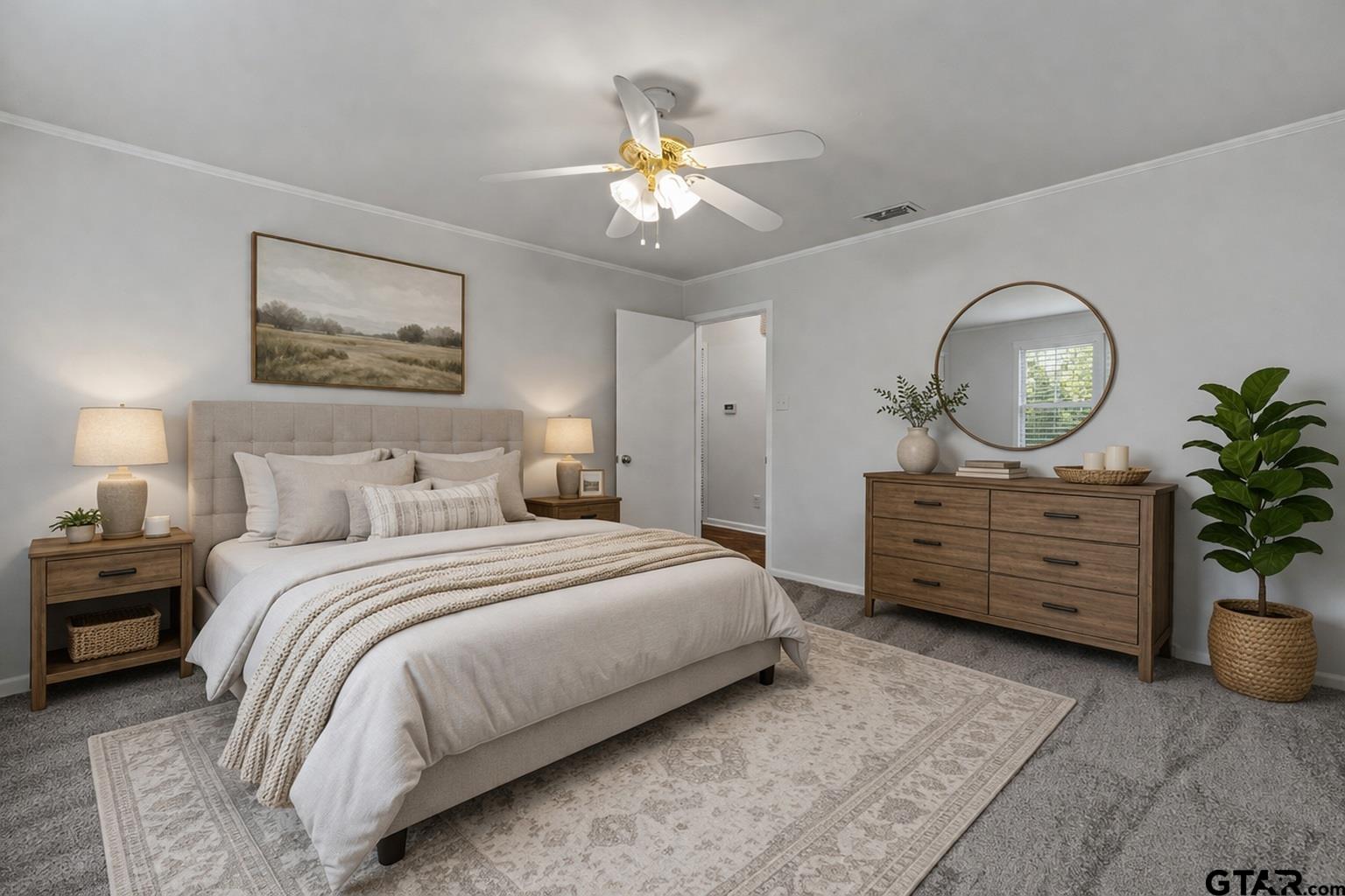7 Lindsey Lane Longview, TX 75601 - Photo 34 of 36 a bedroom with a bed a chandelier and a painting on the wall